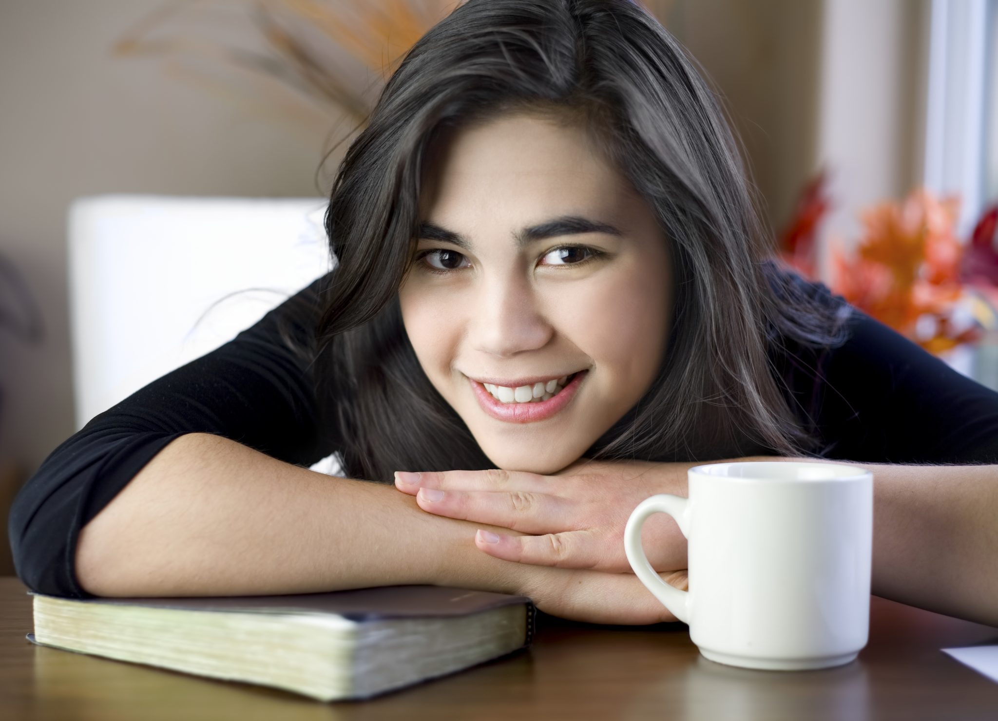 bigstock-Teenage-Or-Young-Woman-At-Tabl-30240239